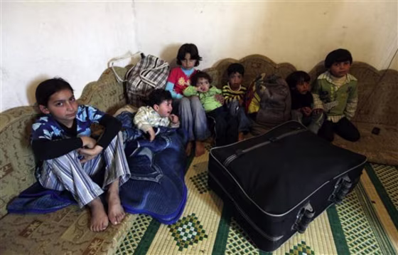 Syrian children gather at the house of their Lebanese relatives after fleeing the unrest in Syria's Wadi Khaled area, about 0.6 miles from the Lebanon-Syria border. When the Arab Spring came to Talkalakh, the little Syrian hill town a few minutes walk from the border village of Wadi Khaled, it seemed to last barely a moment.